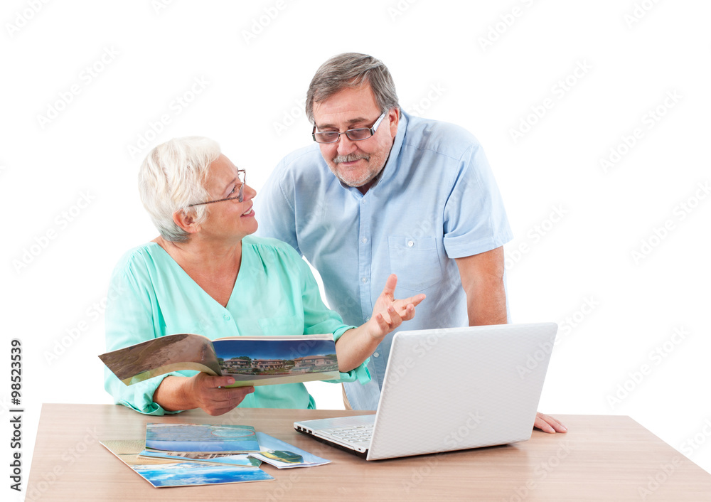 Senior couple choosing the way of travelling Senior couple choosing the way of travelling