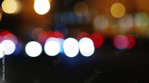 Night road with cars in blurred image photo