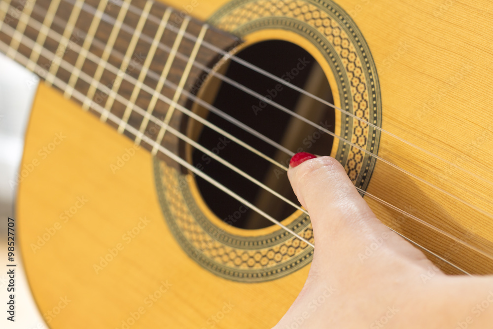 Fototapeta premium Hand playing acoustic guitar..