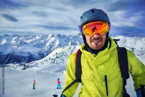 Skier man in winter mountains