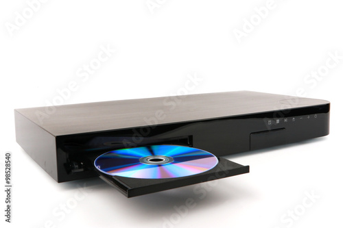 DVD, CD disk insert to dvd player on white background, close-up, isolated