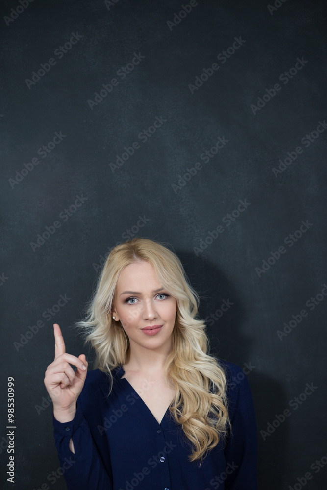 Confident attractive young blond schoolgirl with a bright idea s Confident attractive young blond schoolgirl with a bright idea s