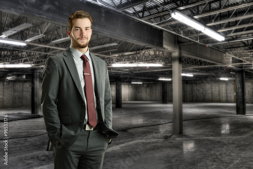 Wallpaper Mural Young bsusinessman inside a construction site Torontodigital.ca