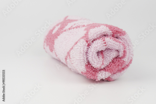 Rolled towel on white background © annuar83