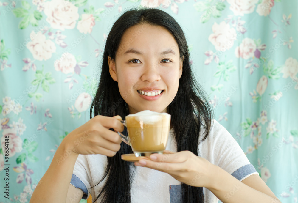 Young asian woman drinking hot coffee in the morning Young asian woman drinking hot coffee in the morning