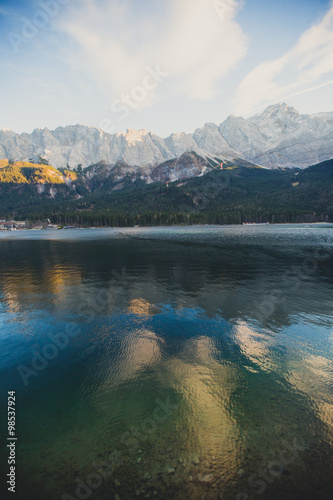 Beautiful vibrant landscape with sundown on mountain lake Eibsee  located in the Bavaria  Germany  near Zugspitze mountain  Alps  Europe.  