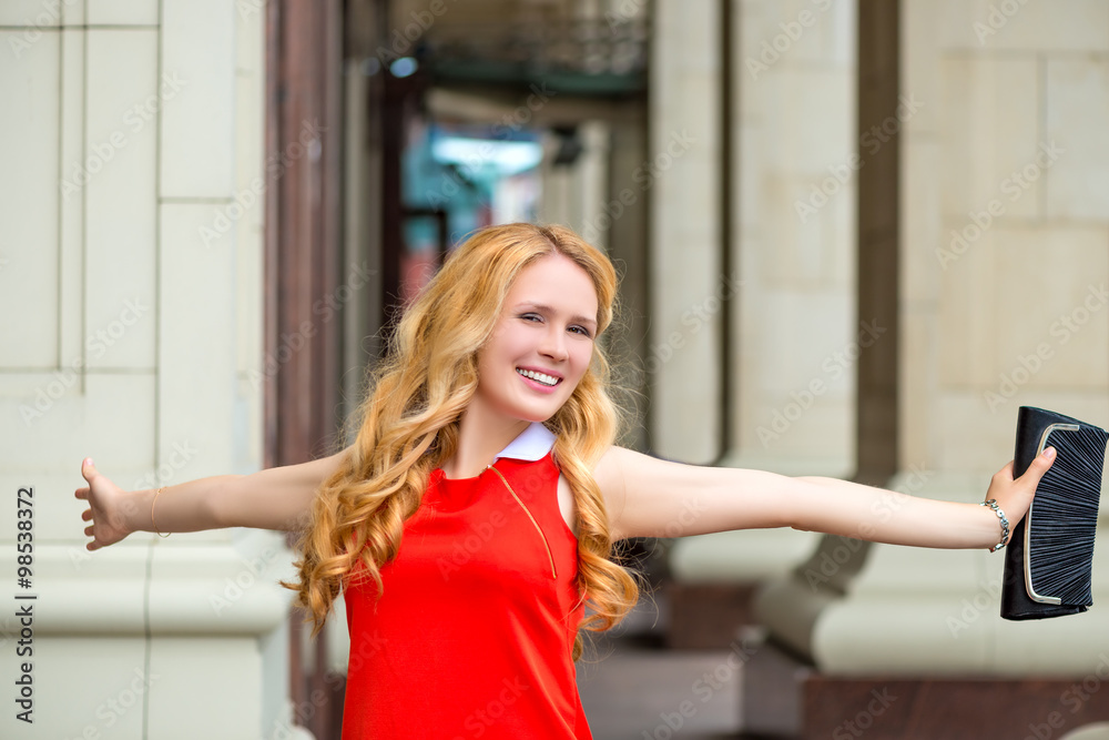 portrait of happy woman with arms outstretched smiling portrait of happy woman with arms outstretched smiling