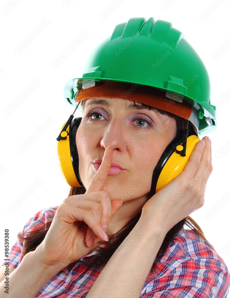 Woman wearing protective helmet and headphones Woman wearing protective helmet and headphones
