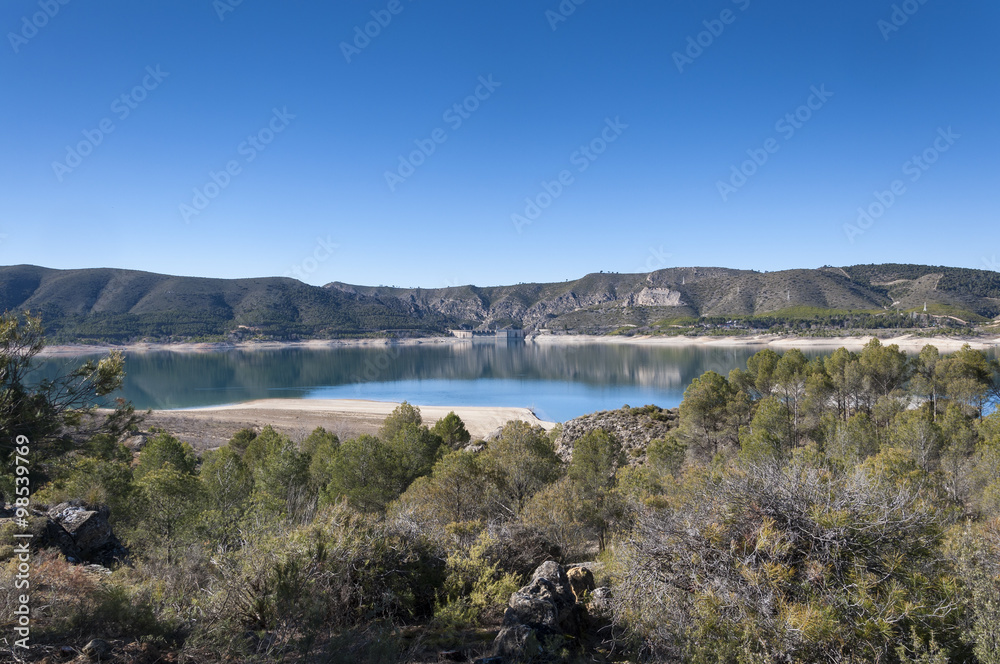 Views of Buendia Reservoir, in the upper waters of the river Tagus, Cuenca, Spain. The surface area of the reservoir measures 8,194 hectares, and it can hold a total of 1,638 cubic hectometres
