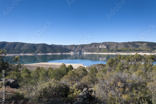 Views of Buendia Reservoir, in the upper waters of the river Tagus, Cuenca, Spain. The surface area of the reservoir measures 8,194 hectares, and it can hold a total of 1,638 cubic hectometres