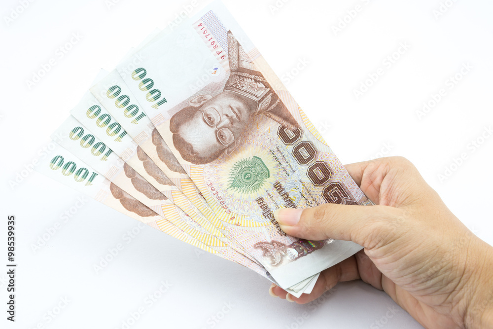 The Thai baht in hand The Thai baht in hand