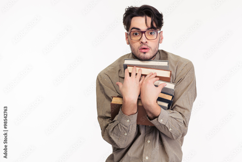 Man in glasses holding many books Man in glasses holding many books