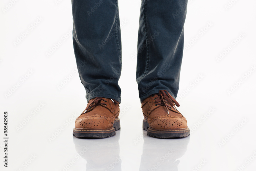 Human legs in jeans and boots Human legs in jeans and boots