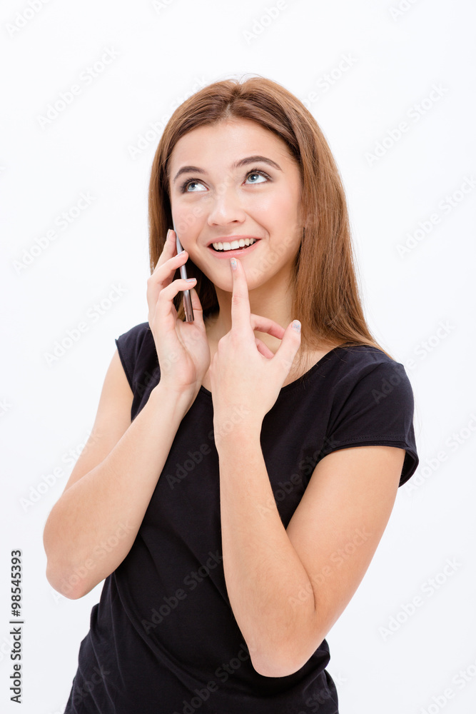 Cute shy curious young female using smartphone Cute shy curious young female using smartphone