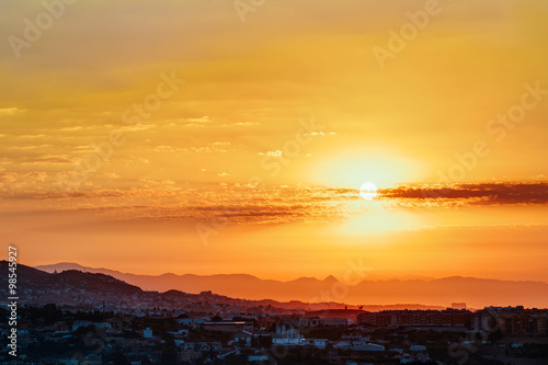 Beautiful Sunset Sunrise Over Mountain and city © Grigory Bruev