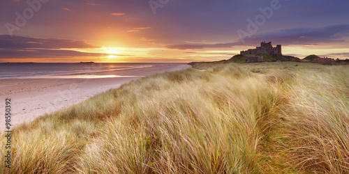 Sunrise over the dunes at Bamburgh Castle  England