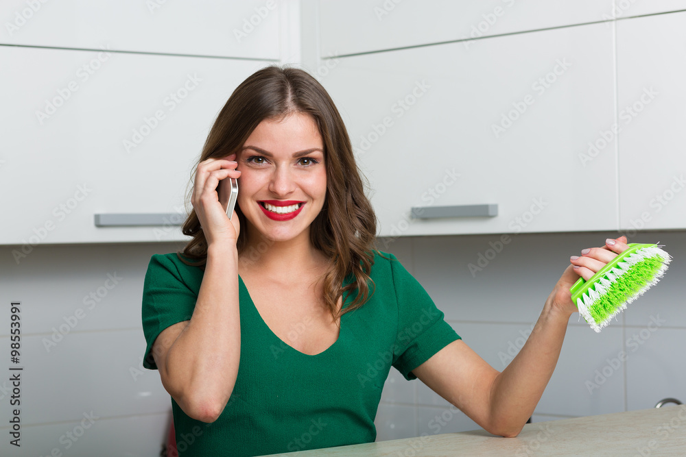 Woman cleaning up her kitchen
