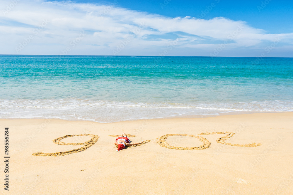 Beautiful young women in red christmas clothes on sea beach with sand caption 2016. New year holidays in hot countries concept.
Beautiful young women in red christmas clothes on sea beach with sand caption 2016. New year holidays in hot countries concept.