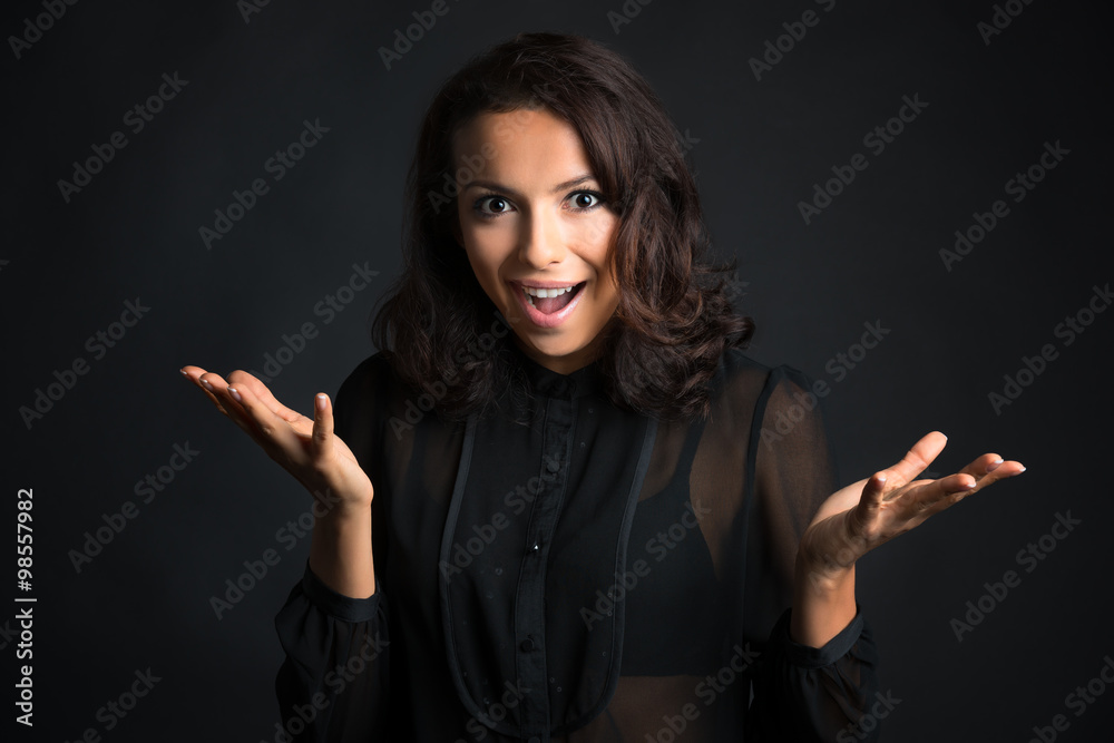 Beautiful woman with shocked expression. Studio shot