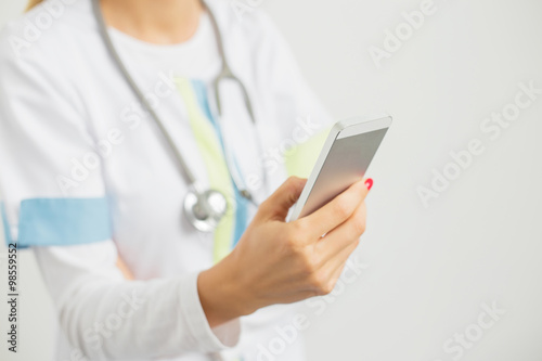 Nurse with phone in her hand 