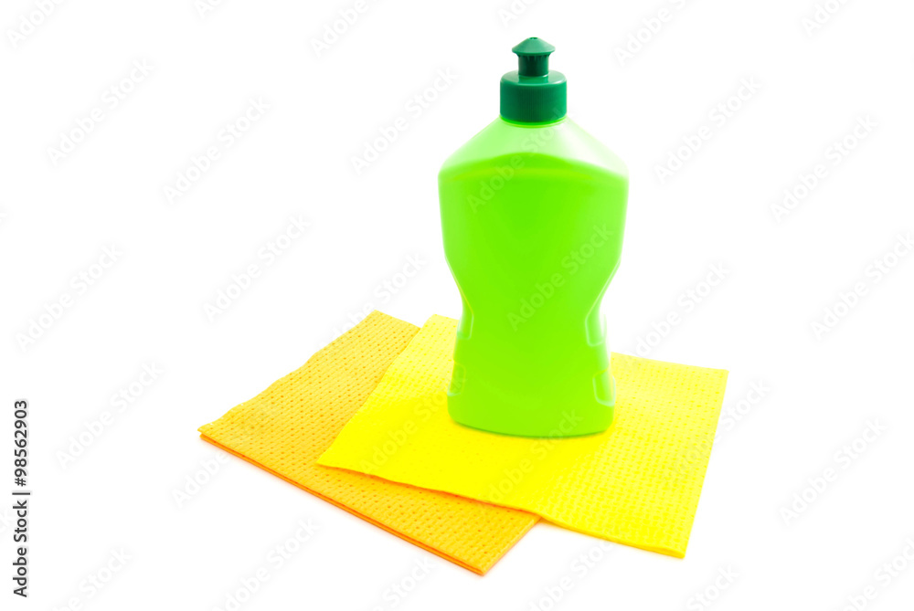 green bottle of detergent and rags