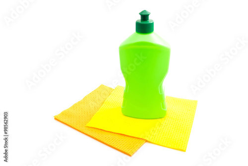 Obraz na płótnie green bottle of detergent and rags w salonie