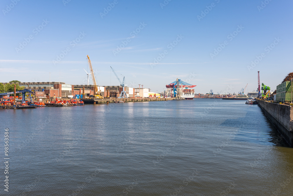 Cargo ship for loading at the quay in the „Ellerholz harbor“ basin in the Hamburg harbor district Steinwerder