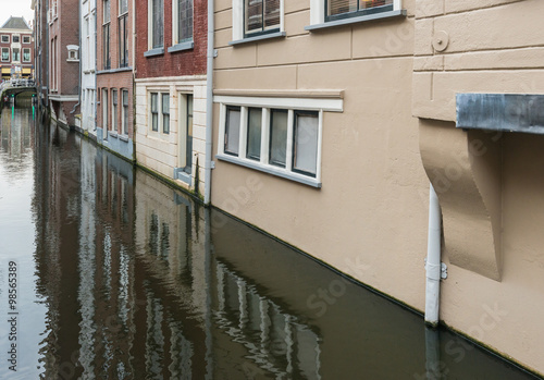 Facades reflected in the mirror smooth water surface