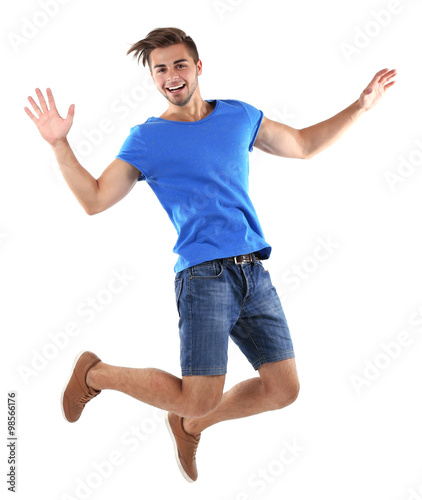 Active guy jumping in joy, isolated on white