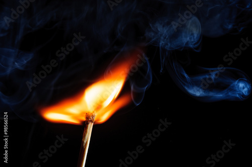 Ignited match and blown off match isolated on black