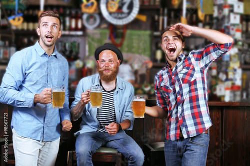 Young men with beer rejoice...