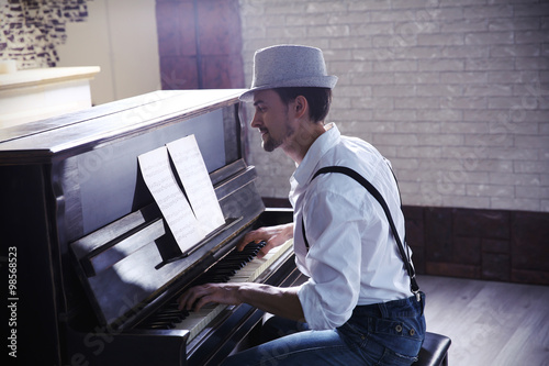 Handsome young man in hat m...