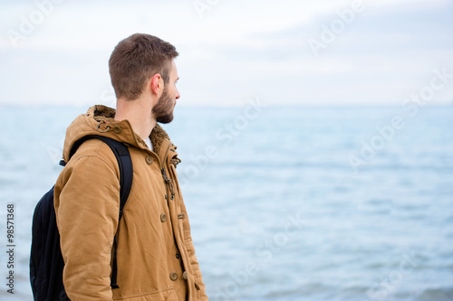 Man looking at the sea outdoors © Drobot Dean