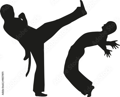 Two man fighting capoeira