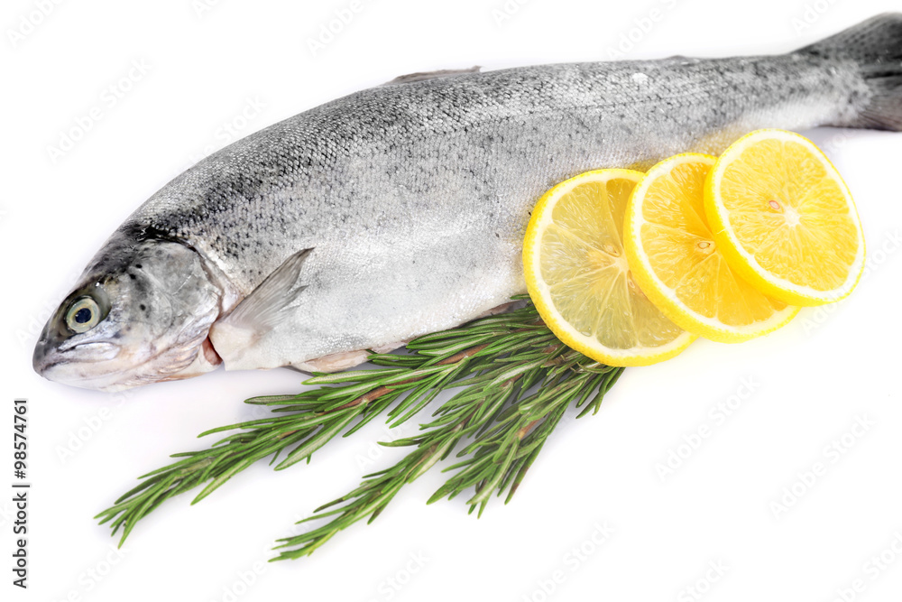 Fresh sea fish with lemon and rosemary isolated on white background Fresh sea fish with lemon and rosemary isolated on white background