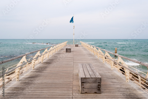 Empty pier with benches on the sea in Pesaro