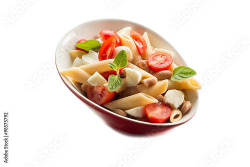 cold pasta salad with slice tomatoes mozzarella and beans