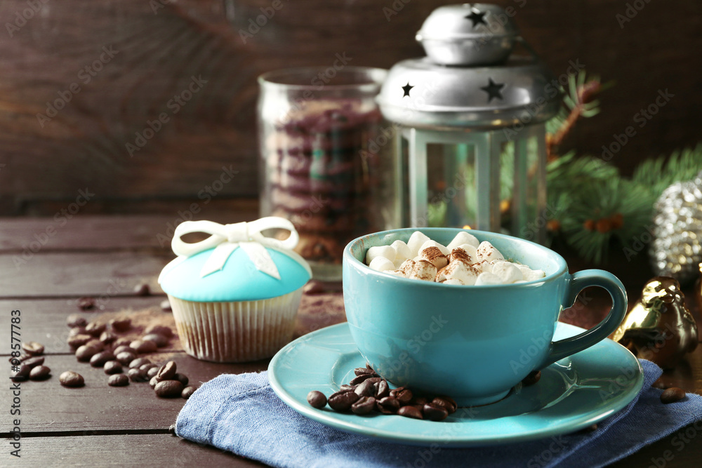 Mug of hot chocolate with marshmallows, fir tree branch on wooden background Mug of hot chocolate with marshmallows, fir tree branch on wooden background
