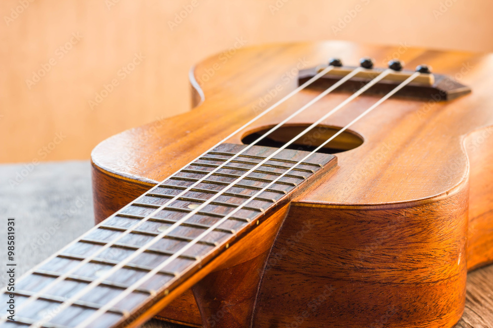 Fototapeta premium Close up of ukulele on table
