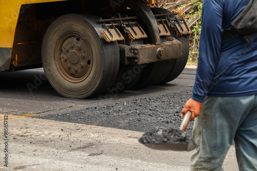 Asphalt spreader in work on site. © thawornnurak