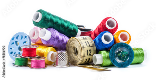 Composition with tailor threads isolated on white background