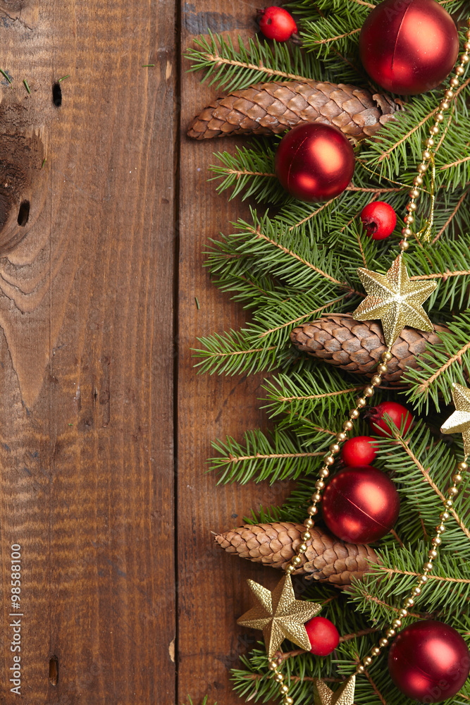 Christmas tree branch, stars, cones, balls on the background of Christmas tree branch, stars, cones, balls on the background of