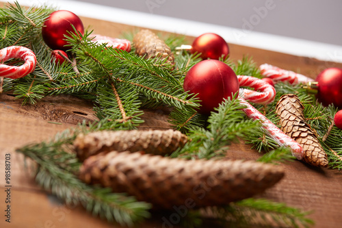 Christmas tree branch, candy, cones, balls