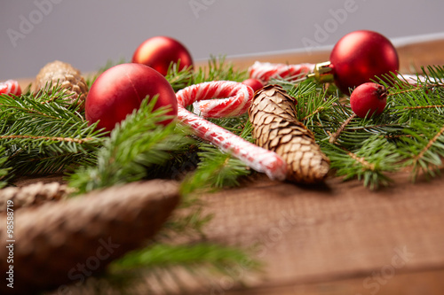 Christmas tree branch, candy, cones, balls