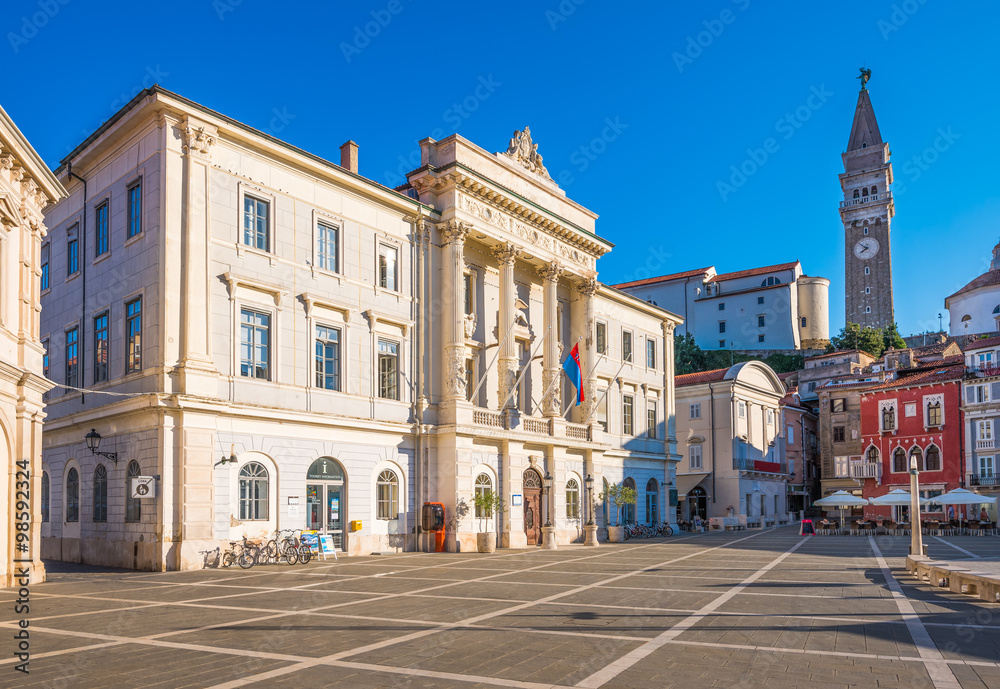 Saint George Church and Town Hall on Tartini Square in Piran Old Town, Slovenia on a Hot Summer Day with Clear Blue Sky