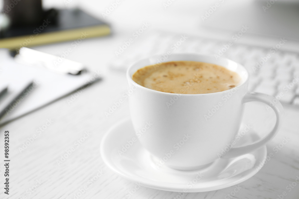 Cup of coffee on workplace background Cup of coffee on workplace background