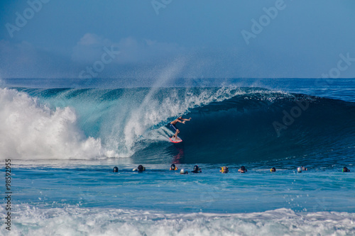 Surfing waves at Bonzai Pipeline on Oahu's North Shore in Hawaii