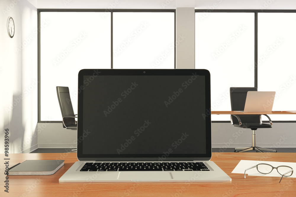Blank black laptop monitor with eyeglasses and diary on wooden t Blank black laptop monitor with eyeglasses and diary on wooden t