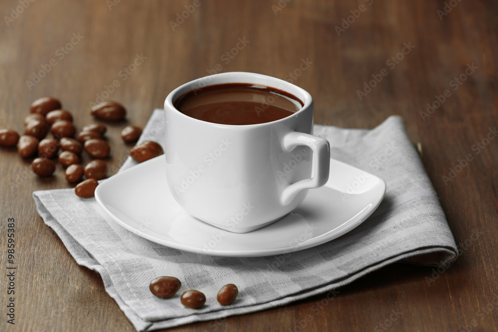 Fototapeta premium Cacao with sweets on wooden background