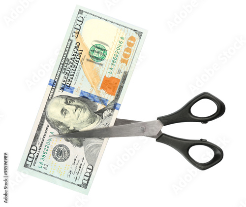 Scissors cut dollar banknote, isolated on white